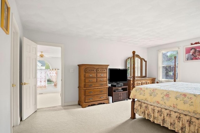 bedroom featuring light carpet