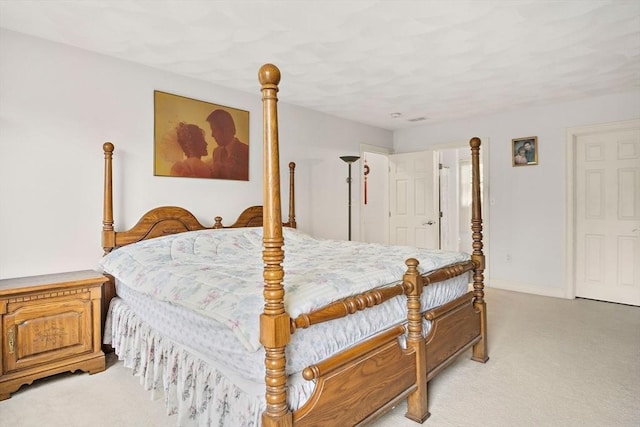 bedroom with light colored carpet