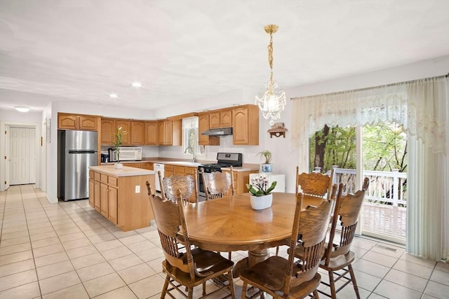 dining space featuring light tile patterned floors, a chandelier, and recessed lighting