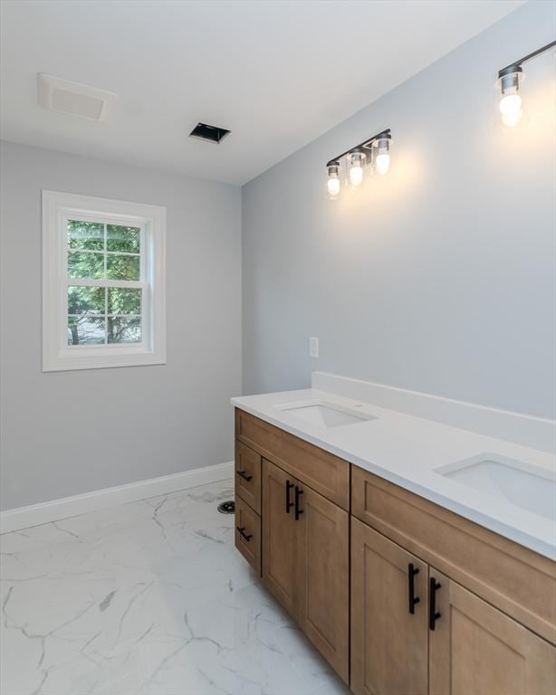 116 Homestead Ave, Springfield, MA 01151 - bathroom with double vanity and marble look tile flooring
