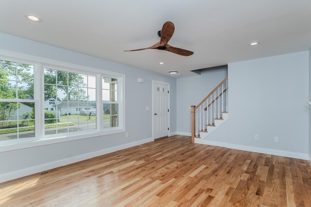 116 Homestead Ave, Springfield, MA 01151 - unfurnished living room featuring a ceiling fan, stairs, light wood-type flooring, and recessed lighting