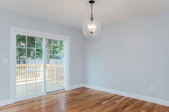 116 Homestead Ave, Springfield, MA 01151 - empty room with light wood-style floors and a chandelier
