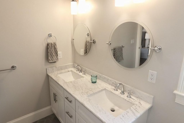 26 Dalby St, Newton, MA 02458 - full bathroom featuring double vanity and baseboards
