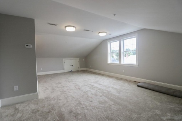 26 Dalby St, Newton, MA 02458 - additional living space featuring vaulted ceiling and carpet floors