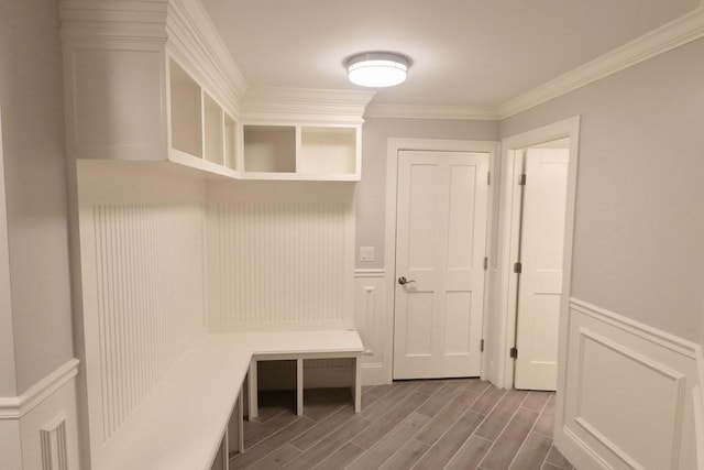 26 Dalby St, Newton, MA 02458 - mudroom with wood finished floors, ornamental molding, wainscoting, and a decorative wall
