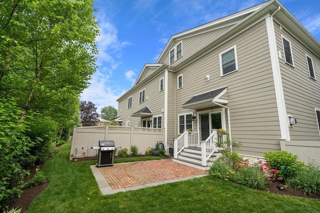 26 Dalby St, Newton, MA 02458 - rear view of property featuring a patio