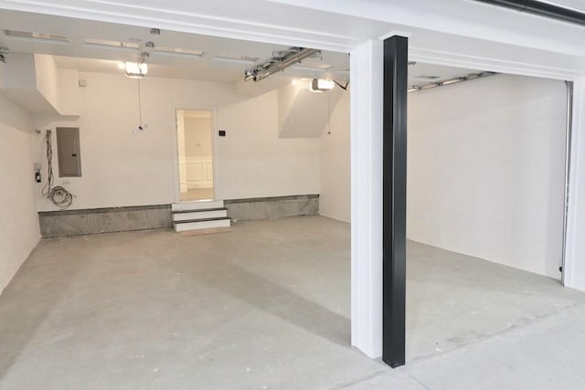 26 Dalby St, Newton, MA 02458 - garage featuring electric panel and a garage door opener