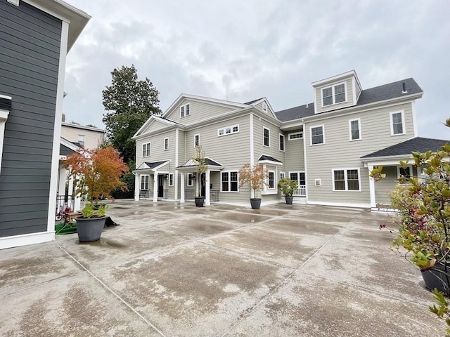 26 Dalby St, Newton, MA 02458 - back of house featuring a patio area