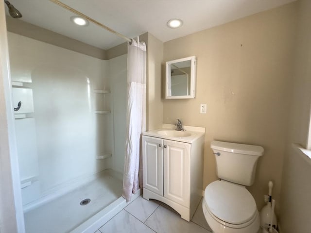 bathroom with vanity, a shower with curtain, and toilet