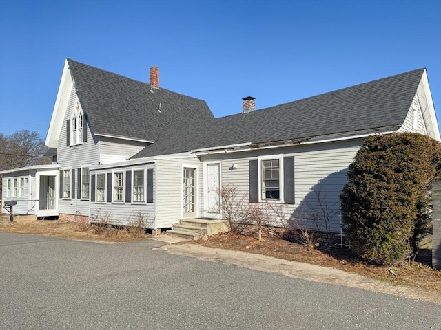 view of front of property with a sunroom