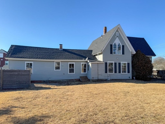 rear view of house with a lawn