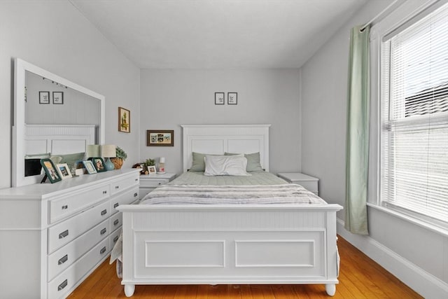 10 Atkins Ave, Lynn, MA 01904 - bedroom featuring multiple windows and light wood-style floors