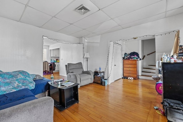 10 Atkins Ave, Lynn, MA 01904 - living room with a drop ceiling, light wood finished floors, and stairway