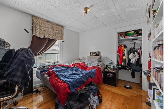 10 Atkins Ave, Lynn, MA 01904 - bedroom featuring wood-type flooring, a paneled ceiling, and a closet