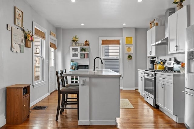 10 Atkins Ave, Lynn, MA 01904 - kitchen with appliances with stainless steel finishes, a sink, plenty of natural light, a kitchen island with sink, and recessed lighting