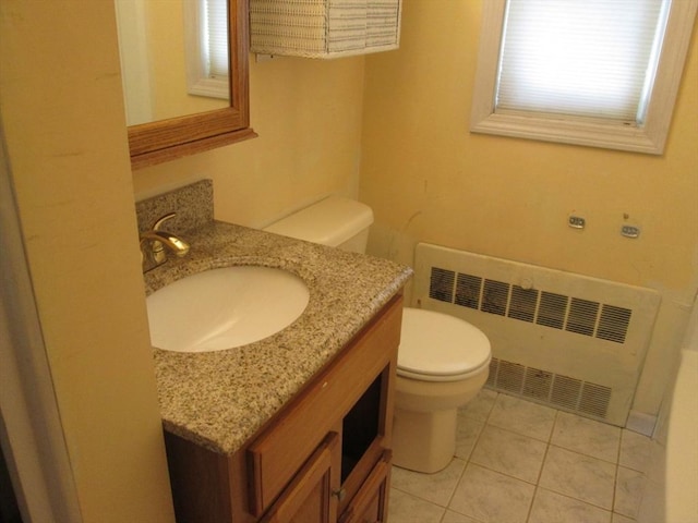 26 Horseshoe Dr Unit 26, Chicopee, MA 01022 - bathroom featuring radiator heating unit, vanity, and tile patterned flooring