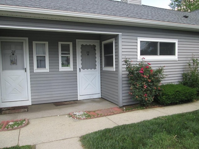 26 Horseshoe Dr Unit 26, Chicopee, MA 01022 - entrance to property with a shingled roof, a chimney, and covered porch