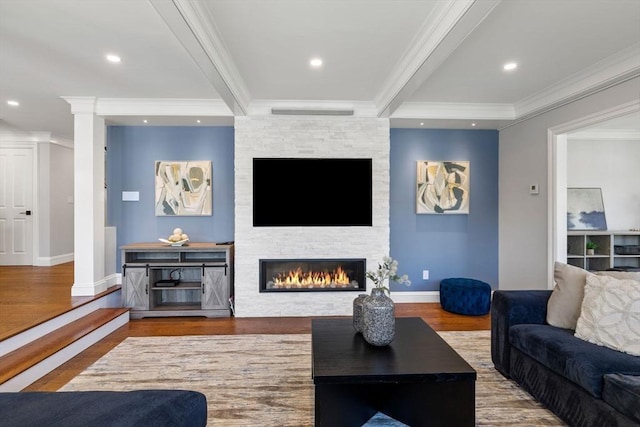 8 Whispering Hill Rd, Woburn, MA 01801 - living area featuring recessed lighting, a stone fireplace, ornamental molding, wood finished floors, and ornate columns