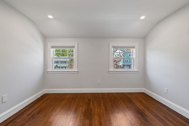 8 Whispering Hill Rd, Woburn, MA 01801 - spare room featuring wood-type flooring, plenty of natural light, and vaulted ceiling