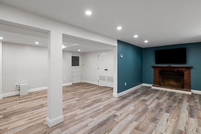 8 Whispering Hill Rd, Woburn, MA 01801 - finished below grade area featuring recessed lighting, a brick fireplace, and wood finished floors
