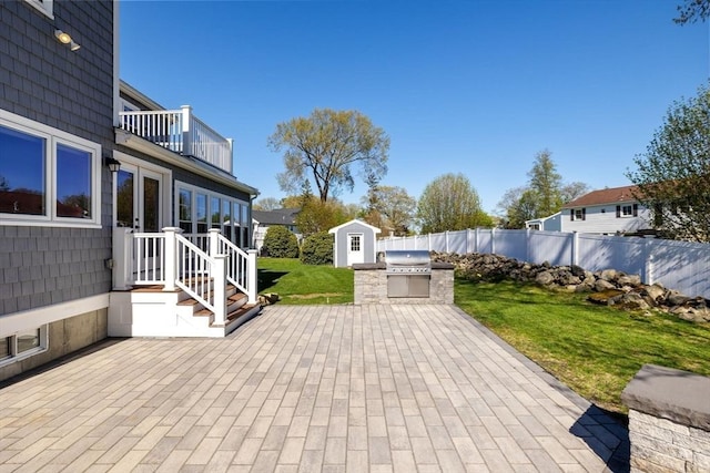 8 Whispering Hill Rd, Woburn, MA 01801 - view of patio featuring fence, a balcony, a storage unit, an outbuilding, and an outdoor kitchen