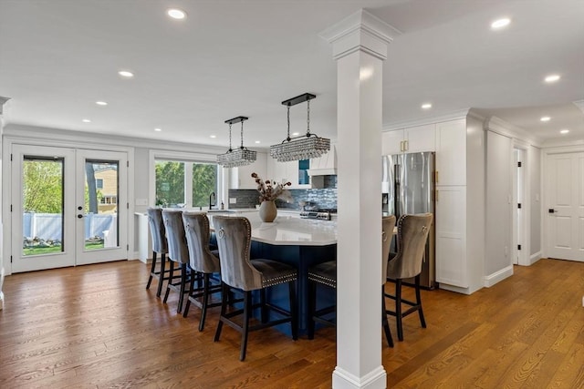 8 Whispering Hill Rd, Woburn, MA 01801 - dining room featuring wood finished floors, ornate columns, french doors, and recessed lighting
