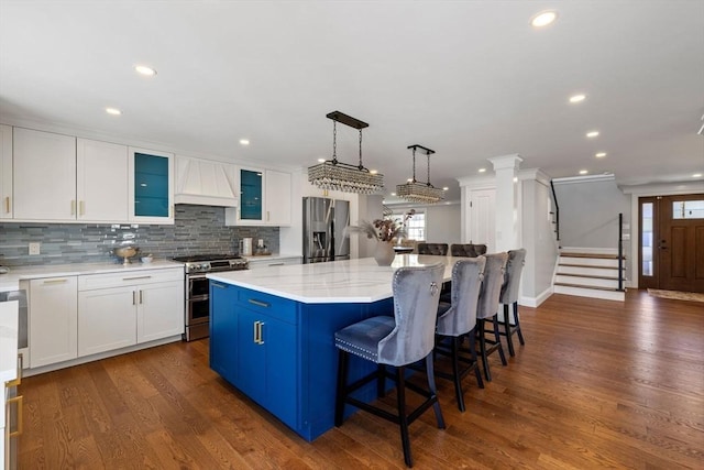 8 Whispering Hill Rd, Woburn, MA 01801 - kitchen with a center island, white cabinetry, premium range hood, decorative backsplash, and stainless steel appliances