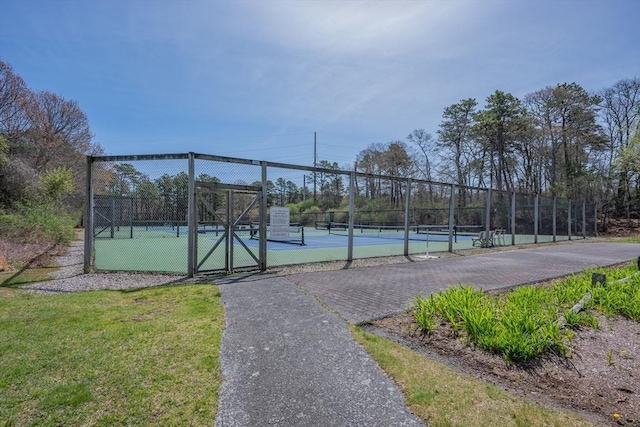 view of tennis court with fence