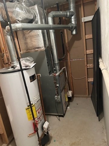 utility room with gas water heater