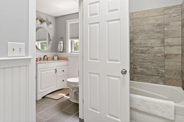 full bathroom featuring shower / tub combination, tile patterned flooring, vanity, and toilet