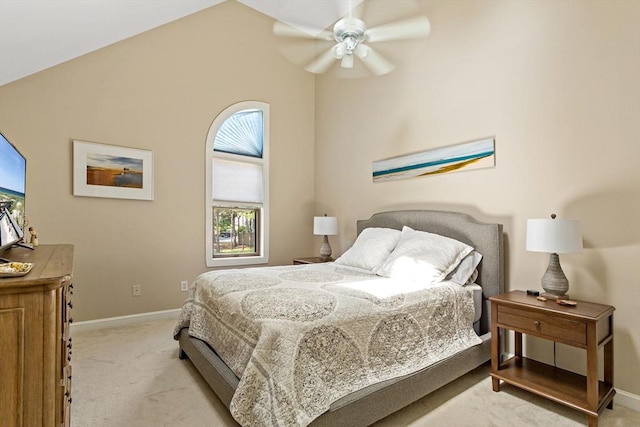 bedroom featuring light carpet, vaulted ceiling, and ceiling fan