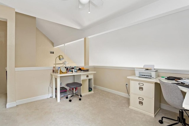 carpeted office space with ceiling fan