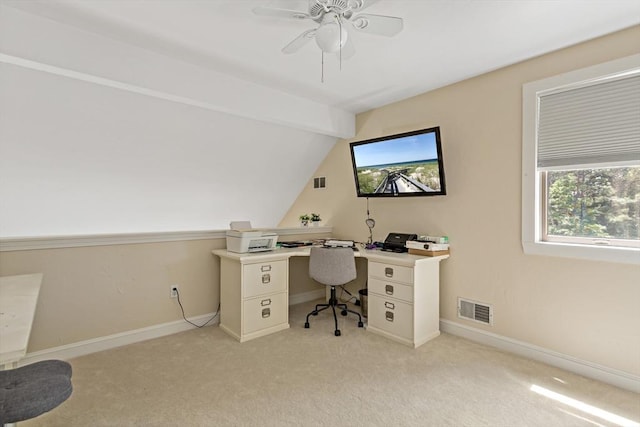 office featuring light carpet, a wealth of natural light, lofted ceiling, and ceiling fan