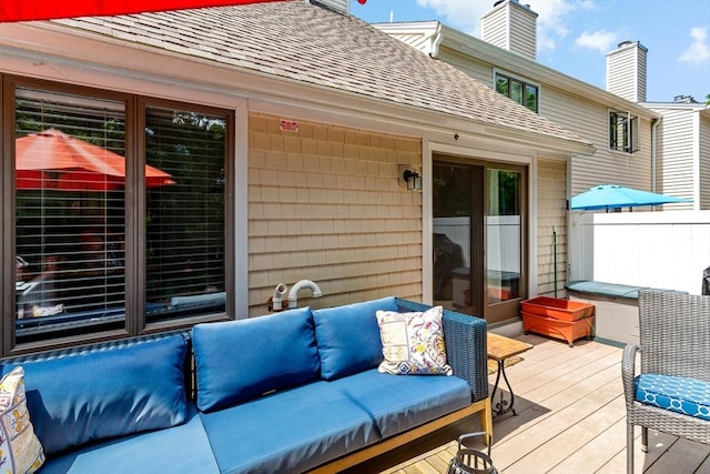 wooden deck featuring an outdoor hangout area