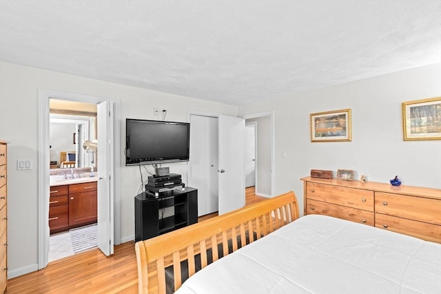 382 Tilden Rd, Scituate, MA 02066 - bedroom featuring light wood-type flooring and connected bathroom