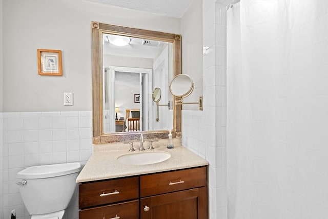 382 Tilden Rd, Scituate, MA 02066 - bathroom with tile walls, vanity, curtained shower, and a wainscoted wall