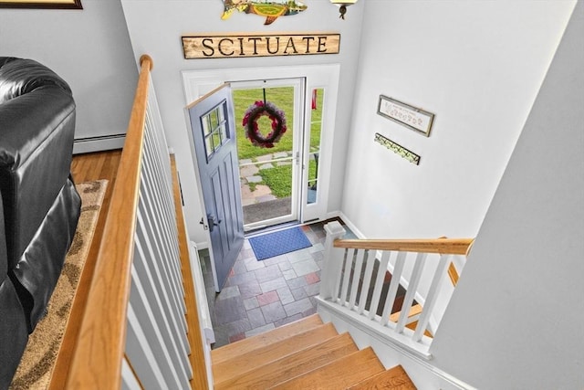 382 Tilden Rd, Scituate, MA 02066 - entrance foyer featuring baseboard heating, stone tile flooring, and stairs