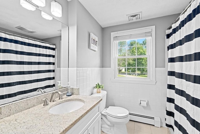 382 Tilden Rd, Scituate, MA 02066 - full bathroom featuring a baseboard heating unit, tile walls, tile patterned flooring, vanity, and wainscoting