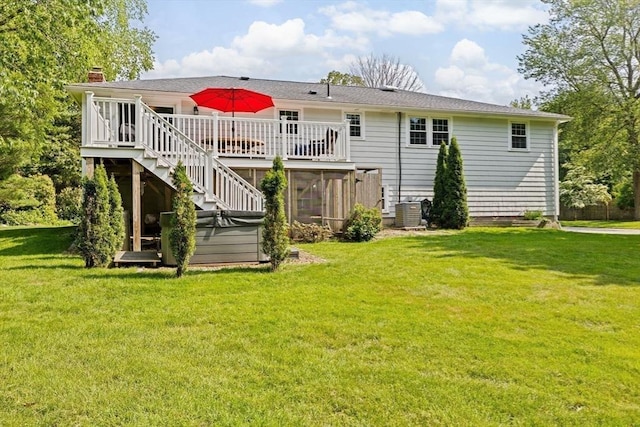 382 Tilden Rd, Scituate, MA 02066 - rear view of house featuring a deck, a chimney, a lawn, stairs, and a sunroom