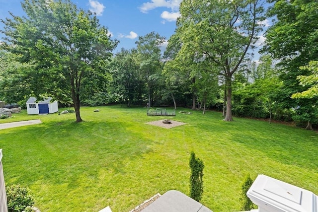 382 Tilden Rd, Scituate, MA 02066 - view of grassy yard with an outbuilding and view of wooded area