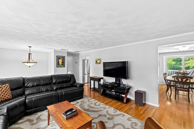382 Tilden Rd, Scituate, MA 02066 - living room with wood finished floors and a textured ceiling