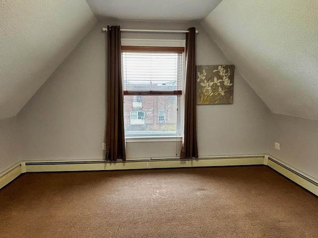 additional living space with lofted ceiling, carpet floors, a textured ceiling, and baseboards