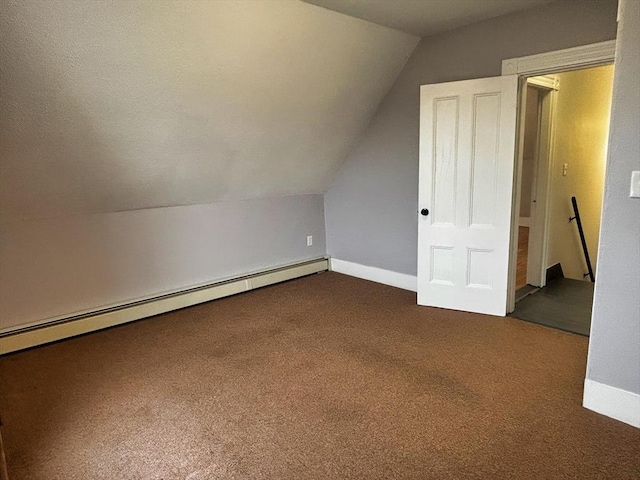 bonus room with a baseboard heating unit, carpet flooring, lofted ceiling, and baseboards