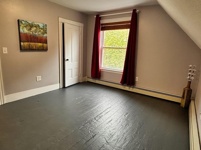 bonus room featuring a baseboard radiator, dark wood-style flooring, vaulted ceiling, and baseboards
