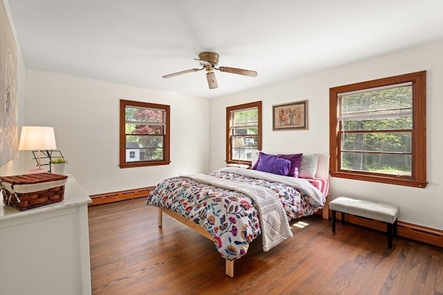 58 Spring St, Wakefield, MA 01880 - bedroom with multiple windows, a baseboard heating unit, and wood finished floors