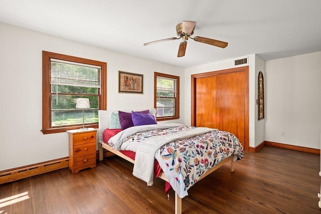 58 Spring St, Wakefield, MA 01880 - bedroom with wood finished floors, a closet, baseboards, baseboard heating, and ceiling fan
