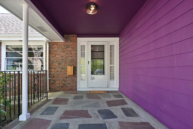 58 Spring St, Wakefield, MA 01880 - view of exterior entry featuring brick siding