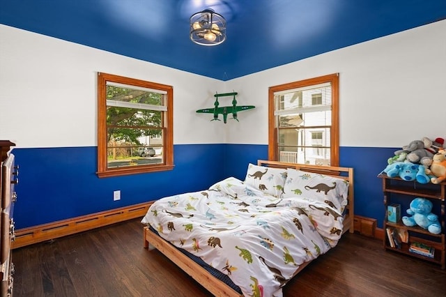 58 Spring St, Wakefield, MA 01880 - bedroom with a baseboard heating unit, multiple windows, and wood finished floors