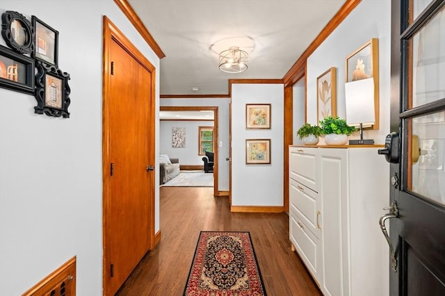 58 Spring St, Wakefield, MA 01880 - corridor featuring crown molding, dark wood-type flooring, and baseboards