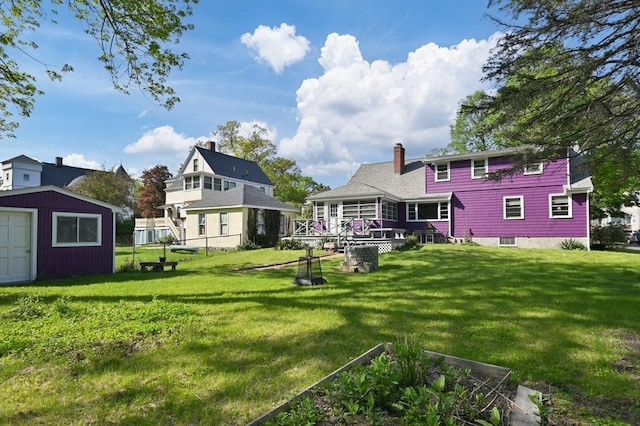 58 Spring St, Wakefield, MA 01880 - back of house featuring an outbuilding, a chimney, and a shed